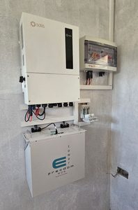 Solar power installation including a Solis S6 inverter, Freedom Won eTower battery, a photovoltaic combiner box and DC fuse holder.